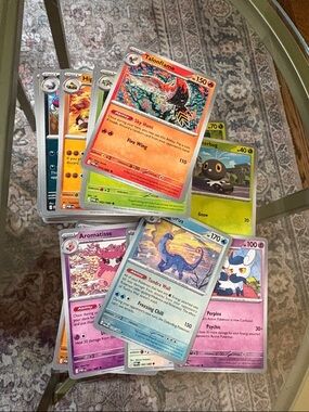 Pokemon Card Lot with Red, Blue, Green, Yellow, Purple, Pink Accents